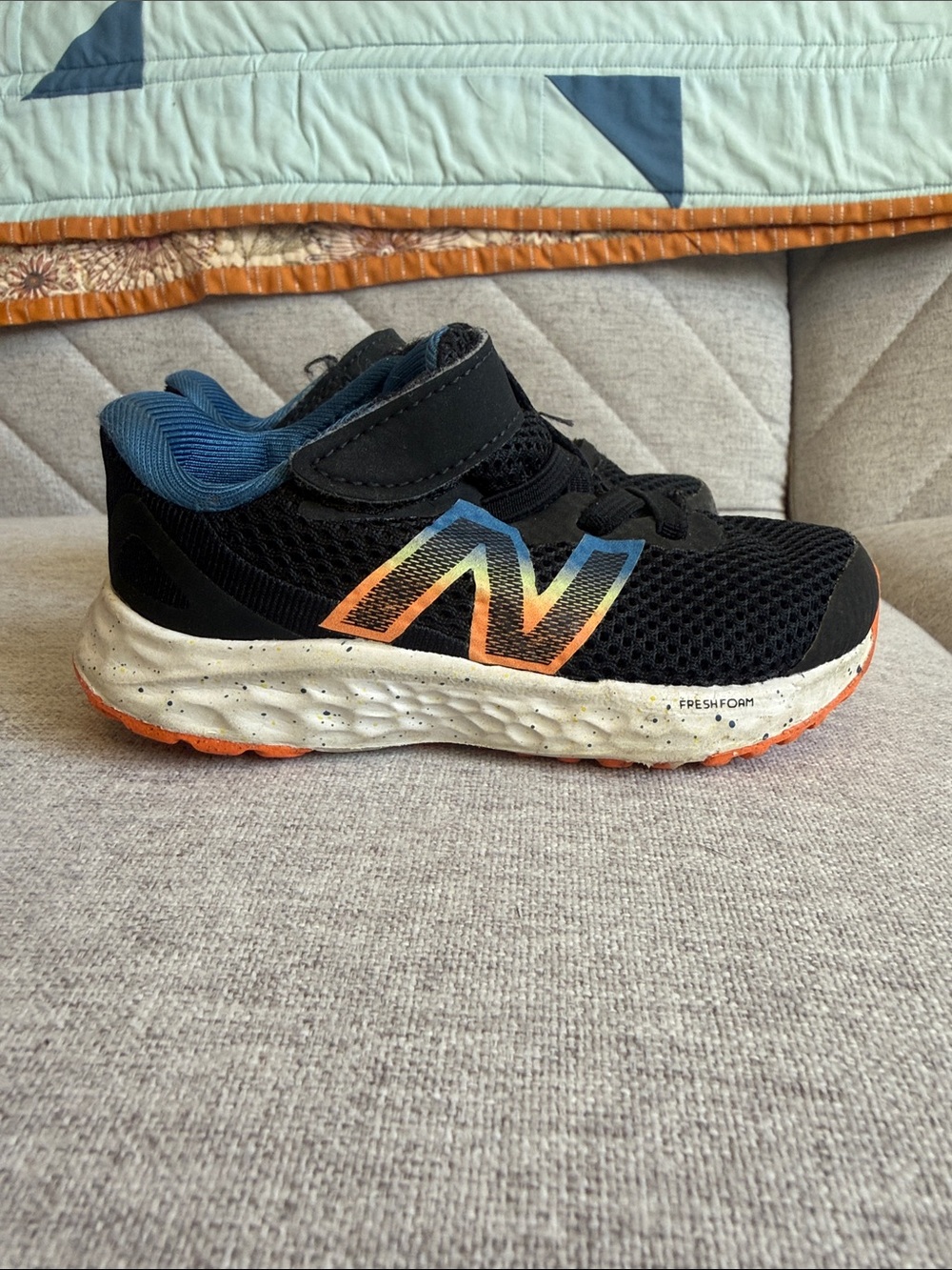New Balance Kids Black Sneaker with Rainbow Gradient